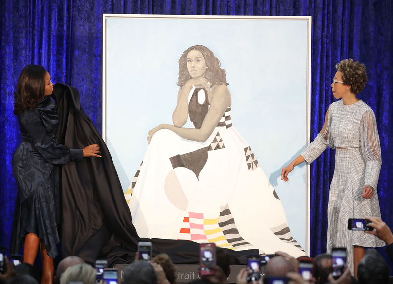 Former U.S. first lady Michelle Obama (L) and artist Amy Sherald unveil her portrait during a ceremony at the Smithsonian’s National Portrait Gallery, on February 12, 2018 in Washington, DC. The portraits were commissioned by the Gallery, for Kehinde Wiley to create President Obama’s portrait, and Amy Sherald that of Michelle Obama. ( Mark Wilson/Getty Images)
